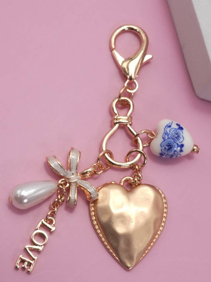 PORCELAIN BOW HEART LOVE BAG CHARM | 80K011 for wholesale by JOSSLYN by wall to wall