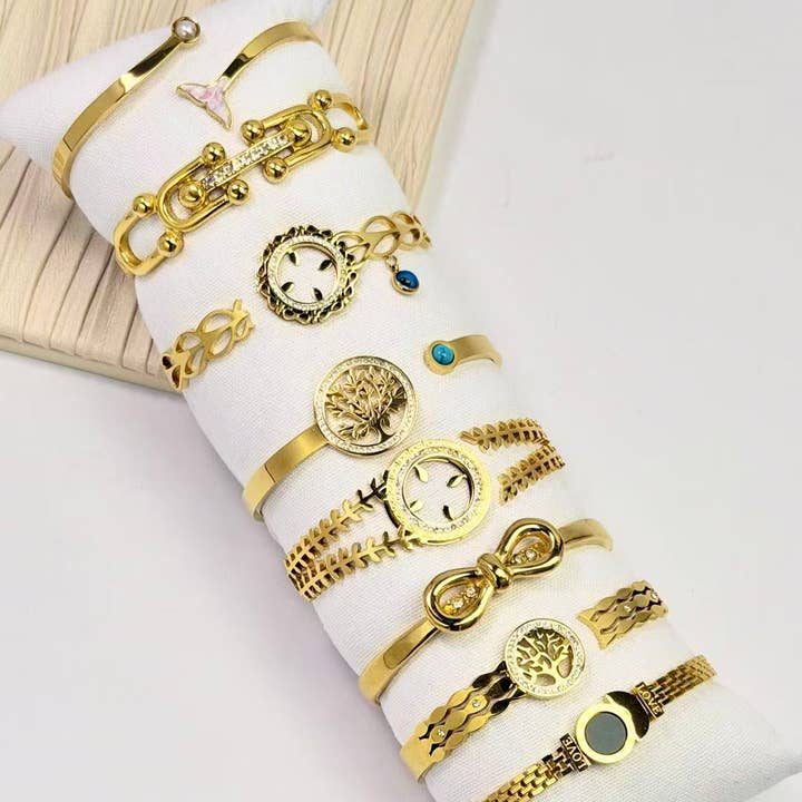 COSMOS - Wholesale Jewelry Set - Set of 8 elegant stainless steel bangle bracelets on display0