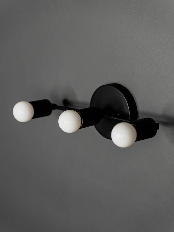 Brontes 3 Light Mid Century Modern Vanity Sconce for wholesale by Lustrous Lumens