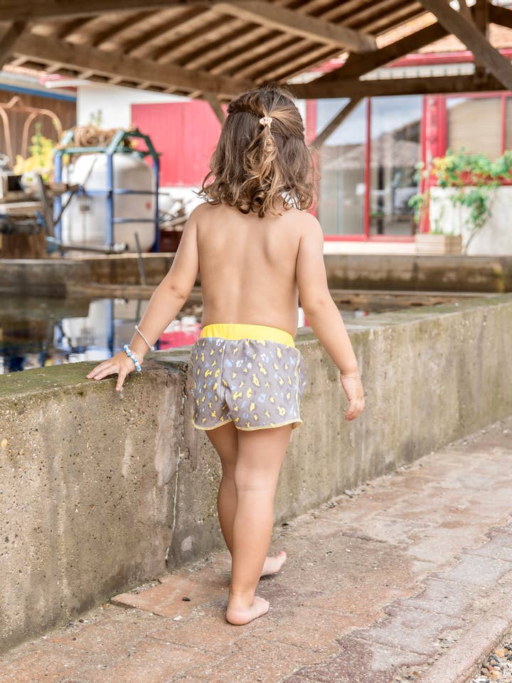 O SHORT “REMEMBER” ANTI-UV UPF50+/ 100% RECICLADO por atacado de BAÏNES SWIMWEAR
