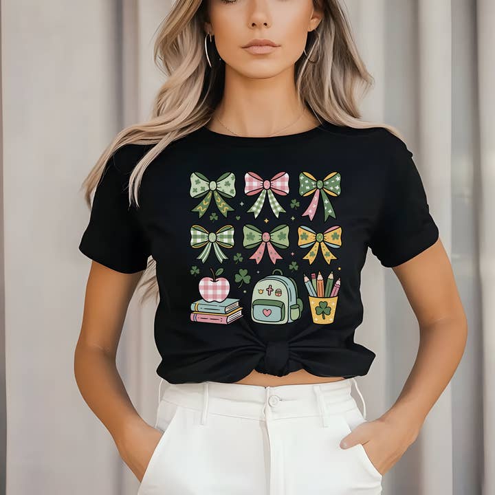 St. Patrick’s Day Teacher Shirt | Coquette Bow Grid Graphic for wholesale by JAC Wholesale