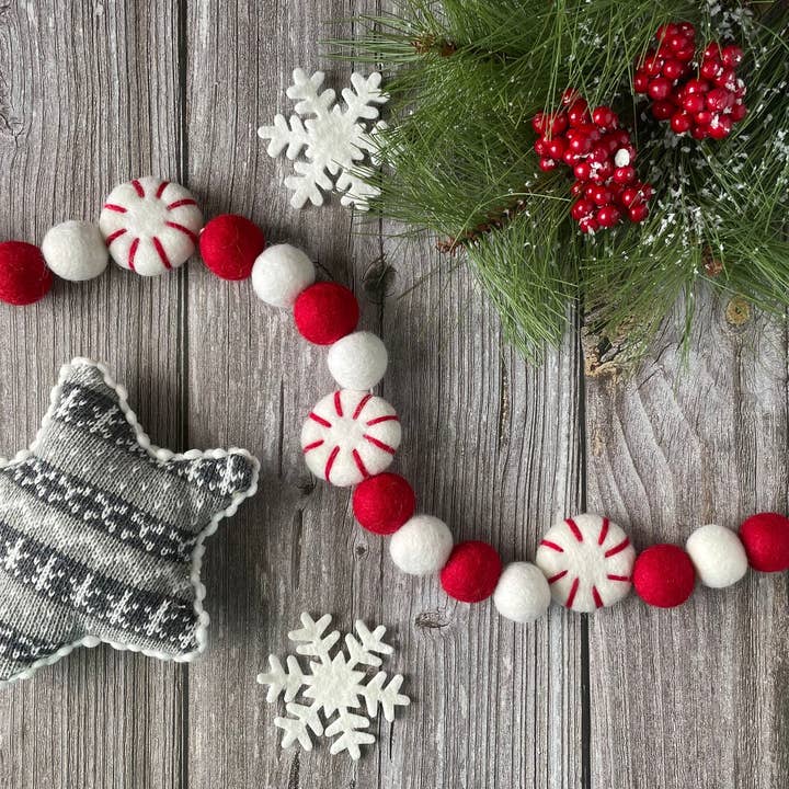 Red & White Peppermints - Holiday felt pom pom garland for wholesale by AKUKU