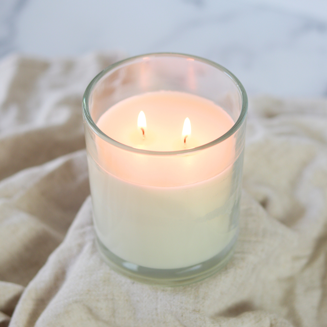 Wholesale Surf Wax + Cocoa Butter 10 oz. Clear Glass Soy Candle for your store Faire