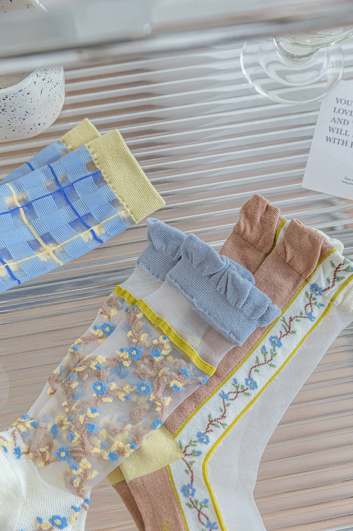 Sheer socks with blue flowers 💙🌼 for wholesale on Faire3