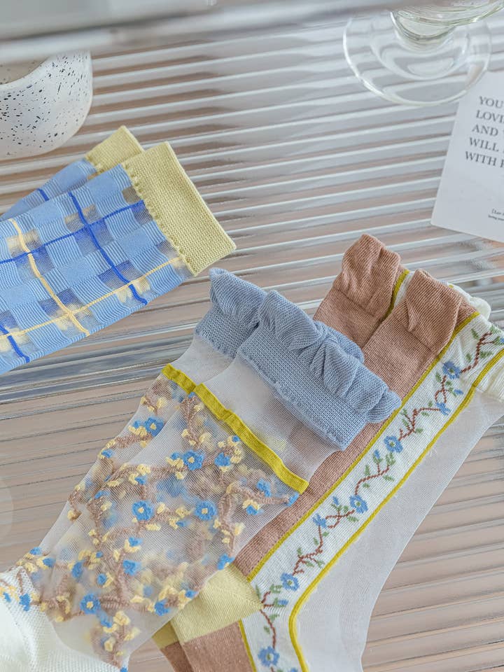 Sheer socks with blue flowers 💙🌼 for wholesale on Faire3