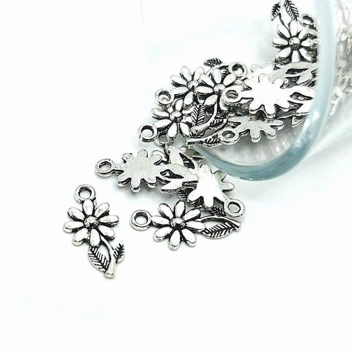 Small Silver Flower Charms, 19x10mm for wholesale by Guerrilla Charm