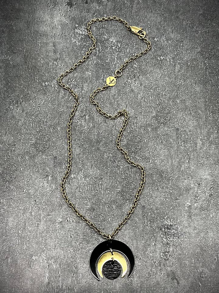 The Shadow edit - Luna Phase Necklace - 30mm Black / Gold for wholesale by Lawless