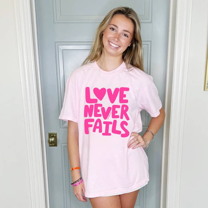 Love Never Fails Youth & Adult Tee for wholesale by Poppy & Pine