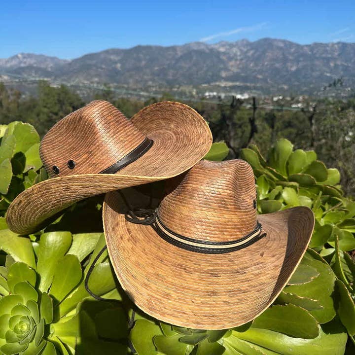 NATURAL Palm leaf hand made wide western cowboy hat with a black fab for wholesale on Faire1
