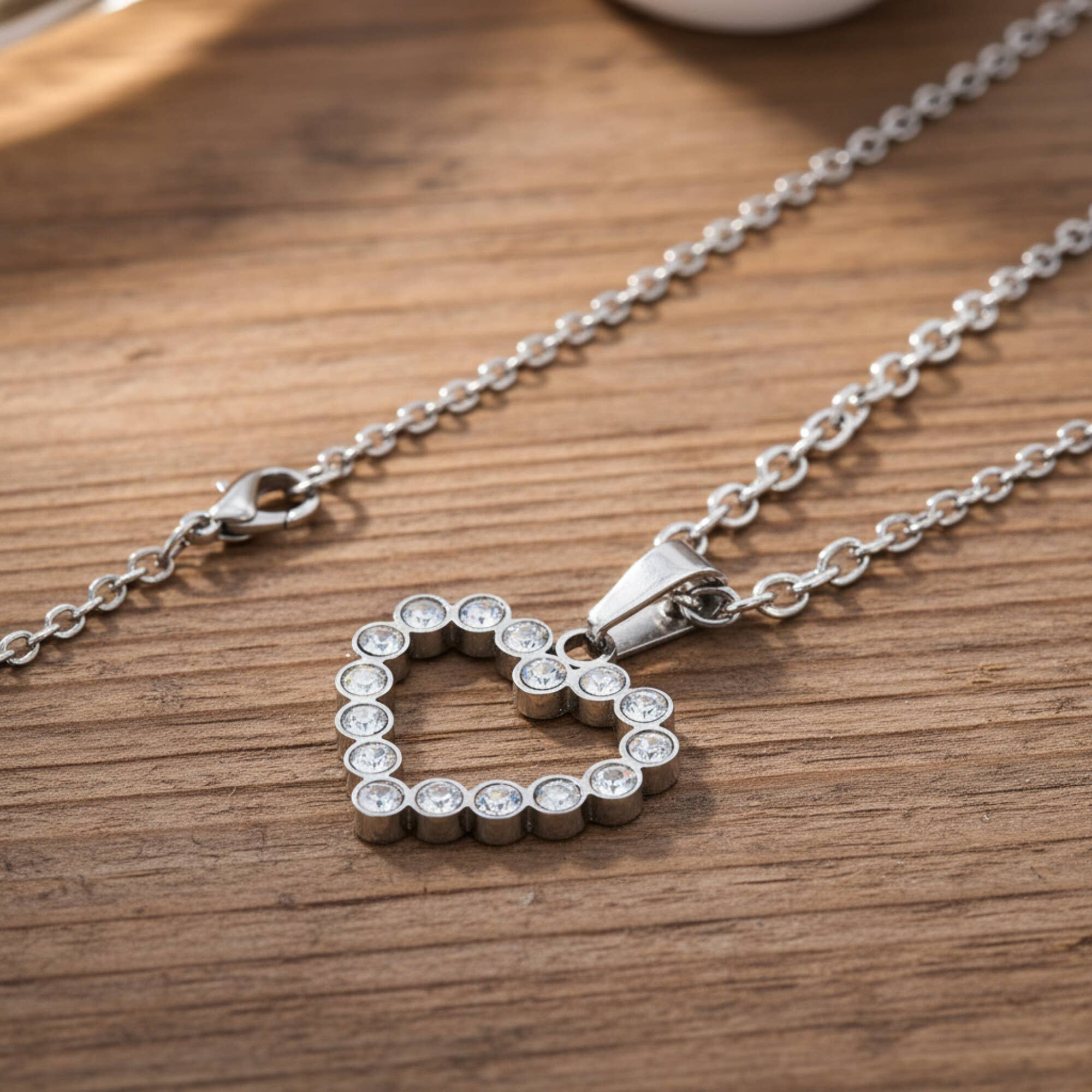 West Coast Jewelry - Vente Colliers à pendentif - Collier en acier inoxydable à cœur ouvert en zircone cubique1