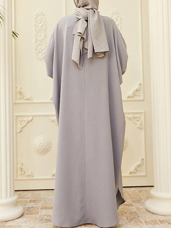 StyleGalX – Vestido - Mulher por atacado – Vestido muçulmano maxi de manga morcego larga com botões, decote redondo e fendas laterais, cores sólidas1
