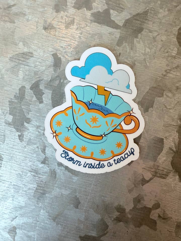 Storm inside a teacup Opalite waterproof sticker for wholesale by Typo Lettering Co