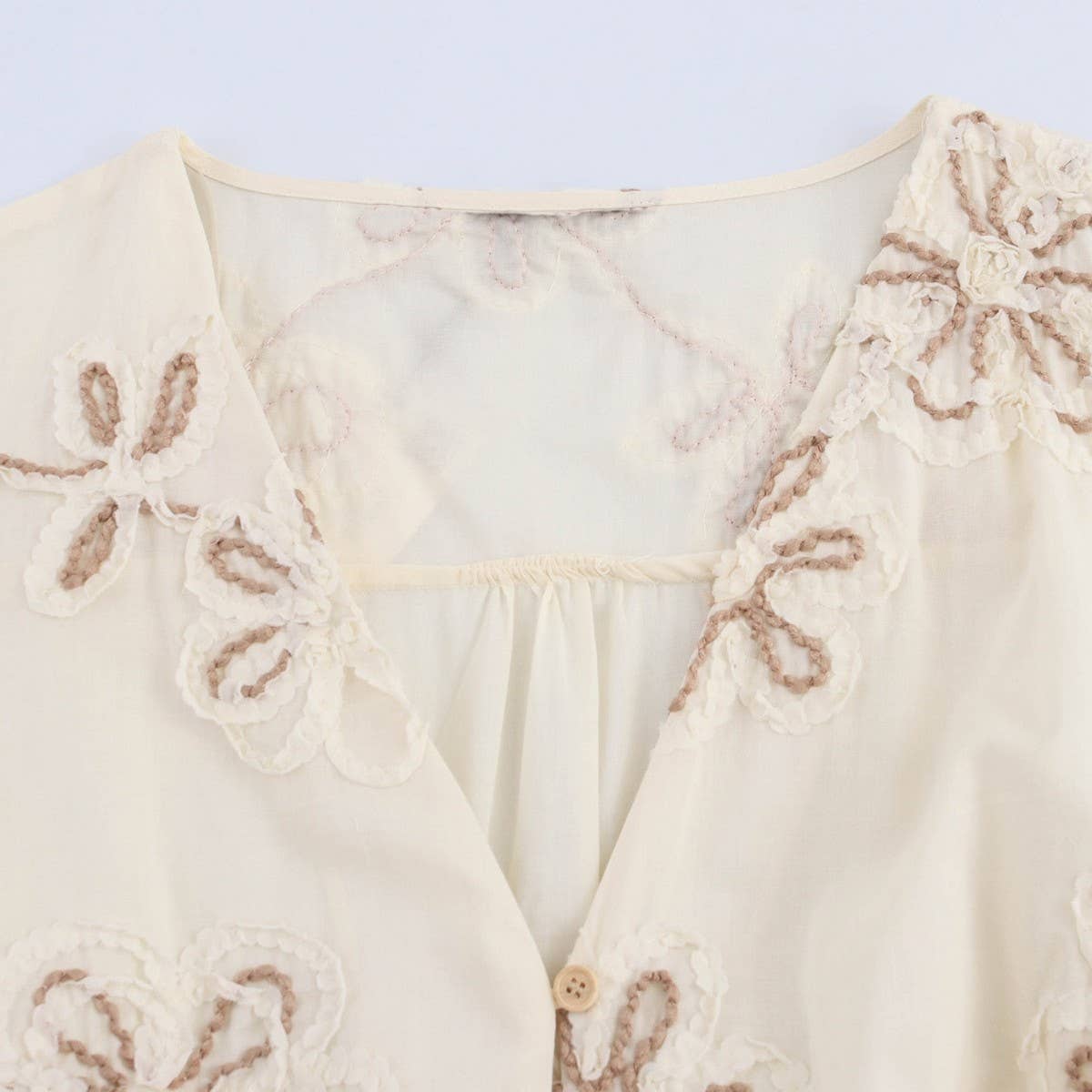 Beige Floral Embroidery MiniDress with Drawstring Cutout_CWDSD8316 for wholesale on Faire5
