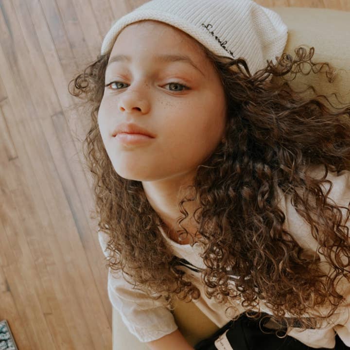 Curled edge beanie cream for wholesale by Le enfant