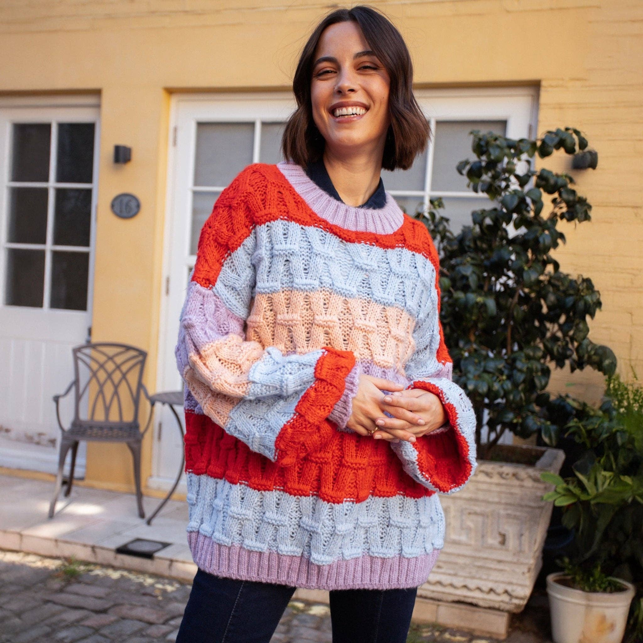 Cara & The Sky – wholesale Knitted jumper – Women′s – Mandy Criss-Cross Stitch Balloon Sleeve Stripe Jumper - Orange19