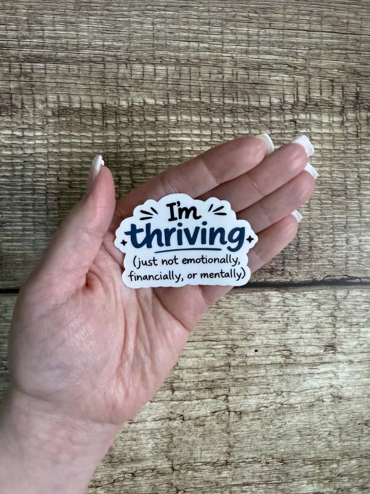 Funny Relatable Waterproof Sticker "I’m Thriving Just Not..." Vinyl Decal Gift for wholesale by Laura Dawn Designs