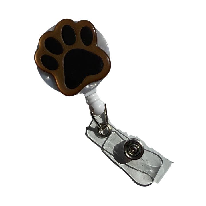 Enrouleur de badge empreinte de patte pour la vente par COLETTE BERNARD