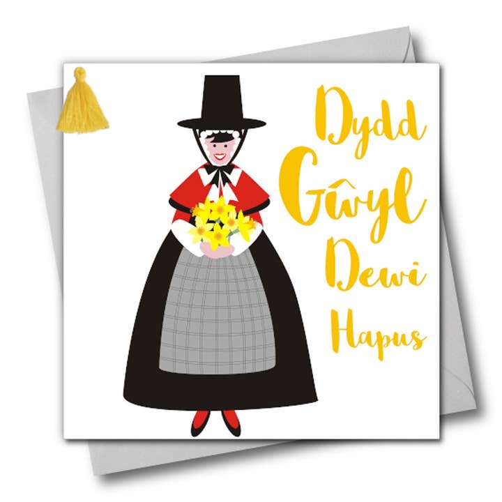 Tarjeta del día de San David galés, dydd gwyl dewi hapus, vestido galés, adornado con borlas para venta al por mayor de Claire Giles Ltd