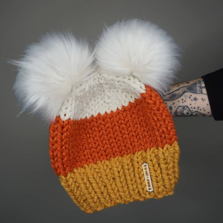 The Candy Corn Double Pom Beanie - Halloween, Fall, knit hat for wholesale by Charlie & Luna Co.