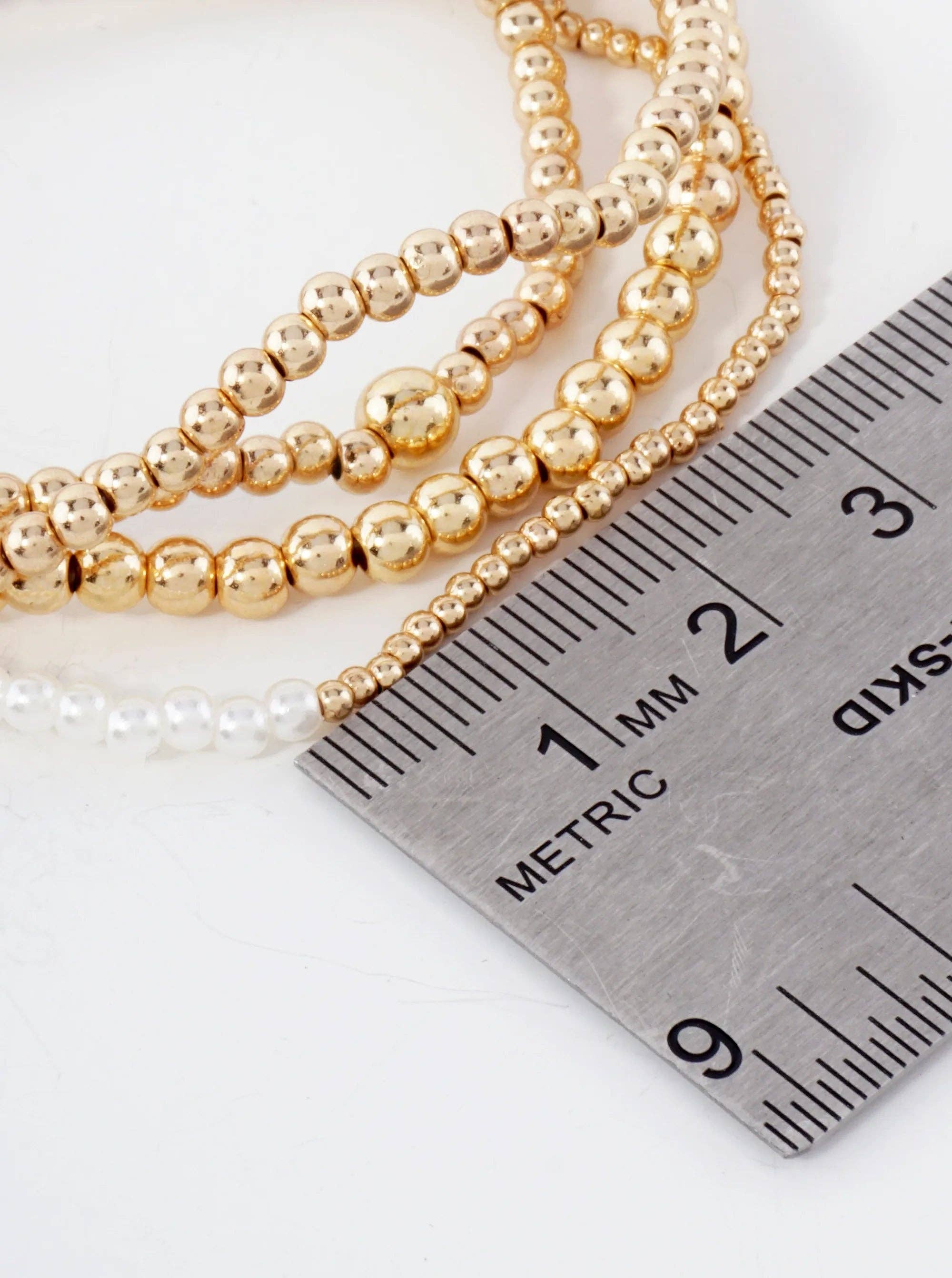 GOLD CREAM 4PC-Set Metallic Beads Pearls Stackable Stretch Bracelets for wholesale on Faire2