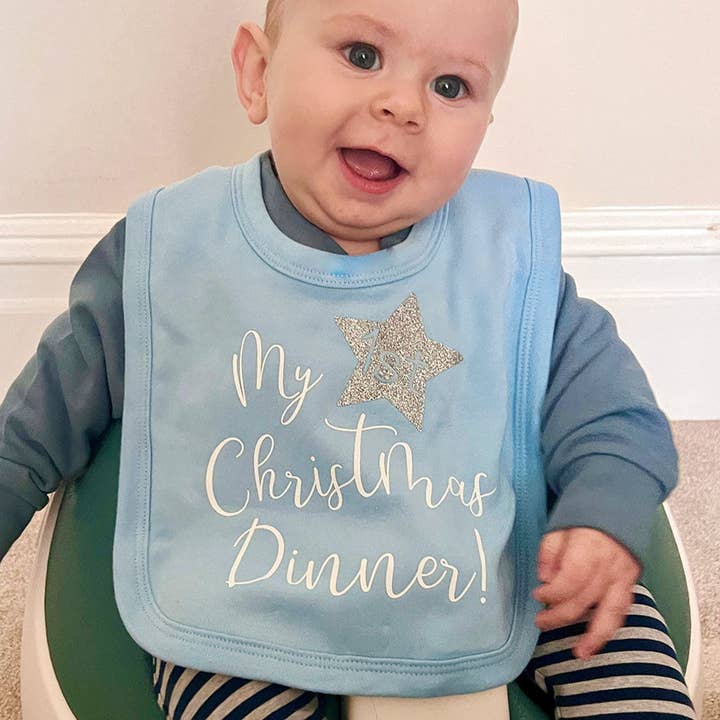 My First Christmas Dinner Baby Bib In Blue And Silver for wholesale by Juliet Reeves Designs