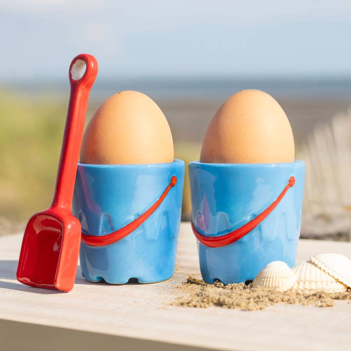 Set of 2 Bucket Shaped Ceramic Egg Cups with Spade Spoons for wholesale by Something Different Wholesale
