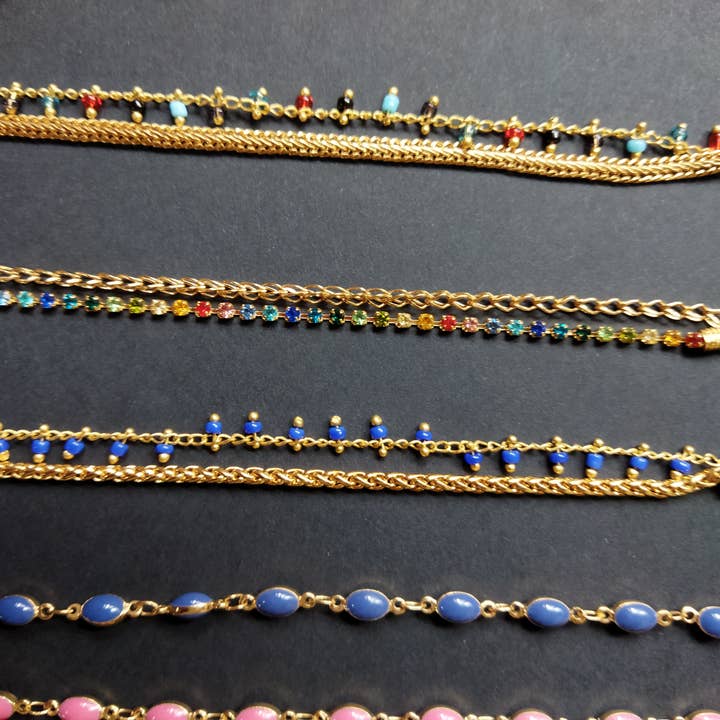 High fantasy bracelets in various gold-plated chains for wholesale by Rachel Ortiz