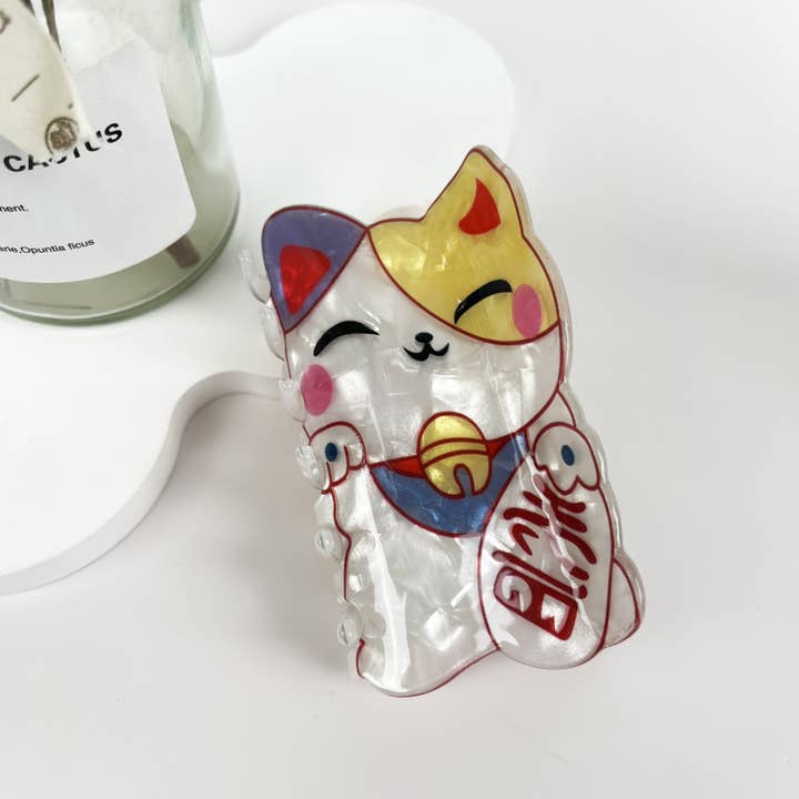 White Japanese Lucky Cat Acrylic Hair Clip for wholesale on Faire