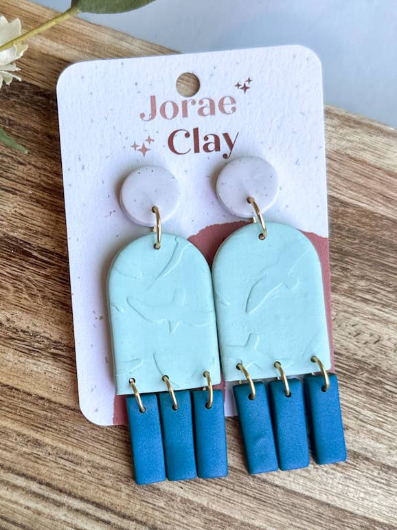 Shades of Blue + Birds Clay Earrings for wholesale by Maude West Company