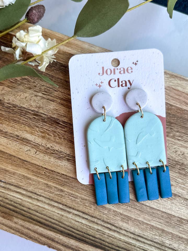 Shades of Blue + Birds Clay Earrings for wholesale by Maude West Company
