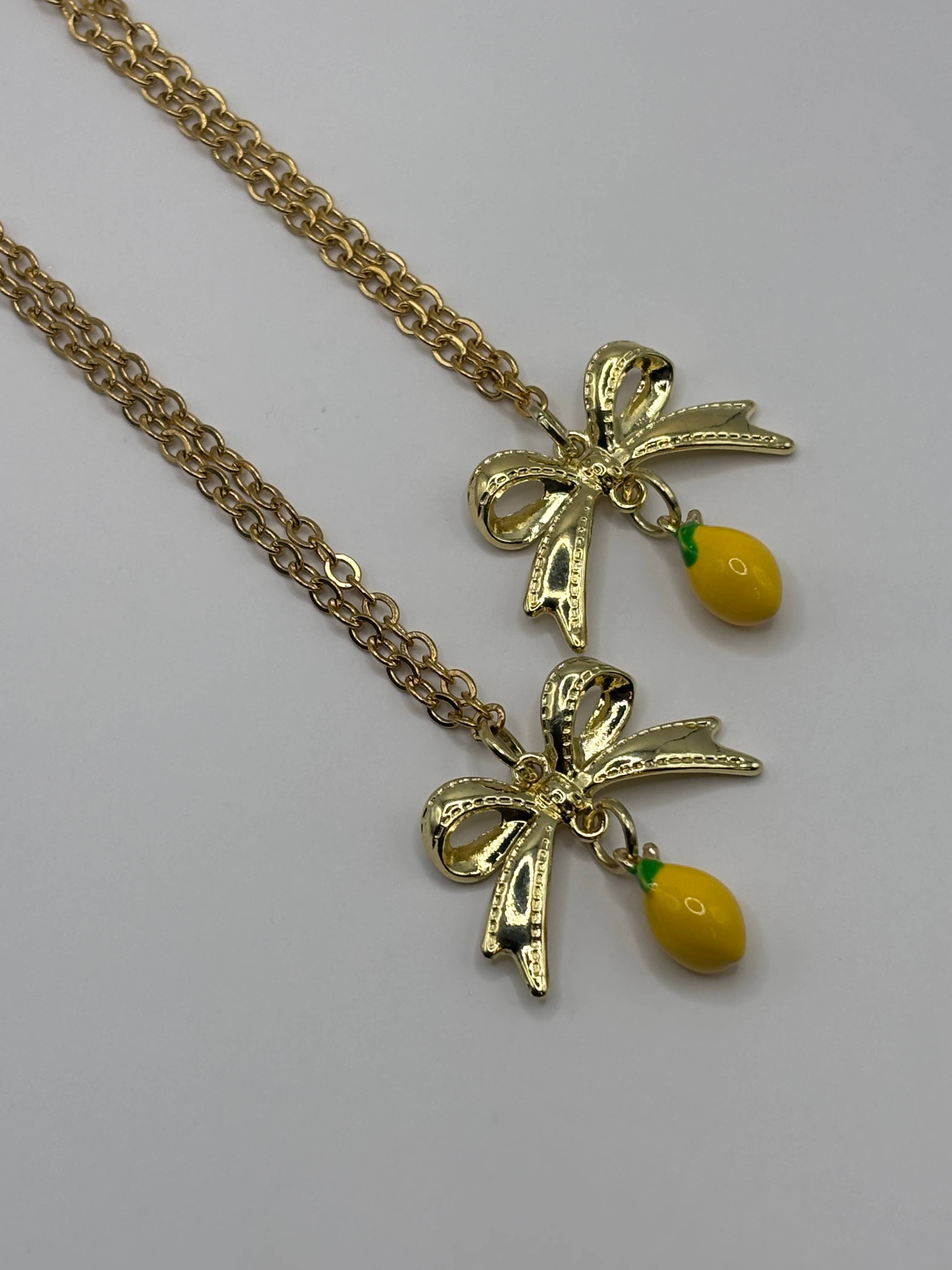 Penny Lane Jewelry Co - Wholesale Pendant/Charm Necklace - Daphne Gold Lemon Bow charm necklace 5