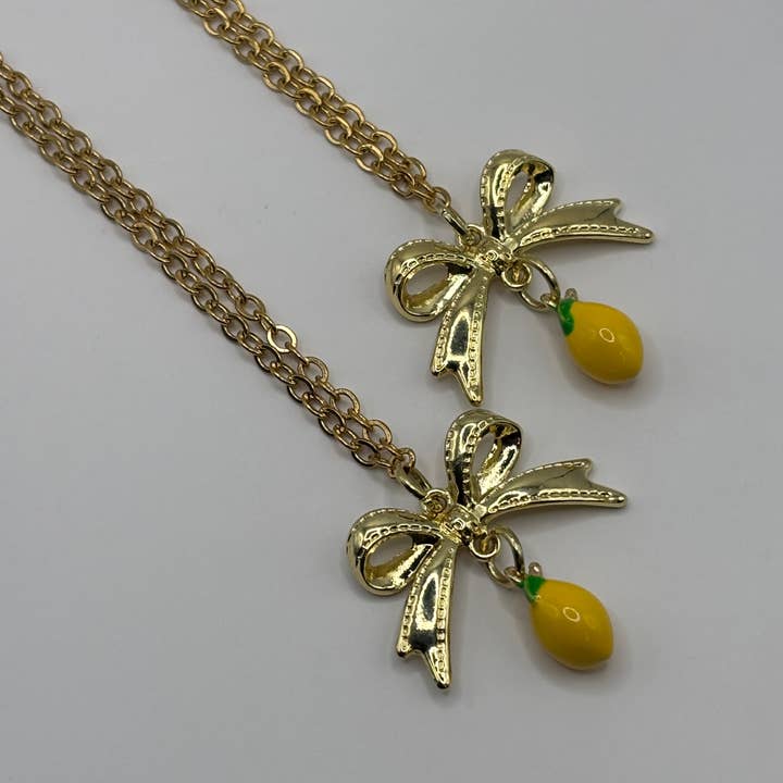 Penny Lane Jewelry Co - Wholesale Pendant/Charm Necklace - Daphne Gold Lemon Bow charm necklace 5