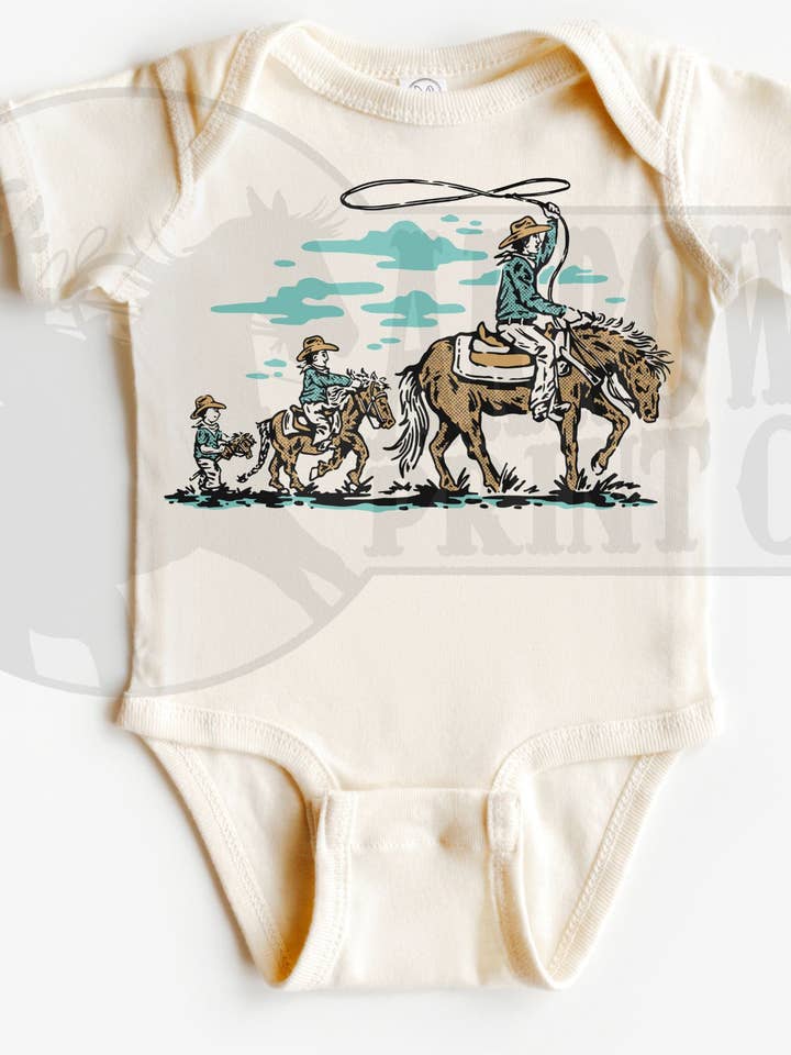 Cowboy Evolution S/S Onesie or Tee for wholesale by The Fringed Pineapple