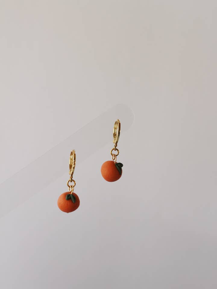 Huggies à la mandarine pour la vente par Woven