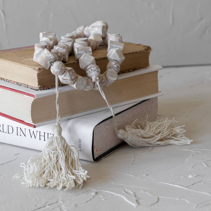 Alek White Coastal Wood Bead Garland with Cotton Tassels for wholesale by Foreside Home & Garden