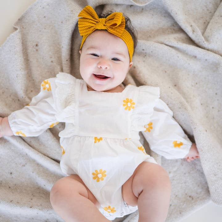 Yellow Daisy Romper Dress for wholesale by SOL Baby Clothing & Accessories
