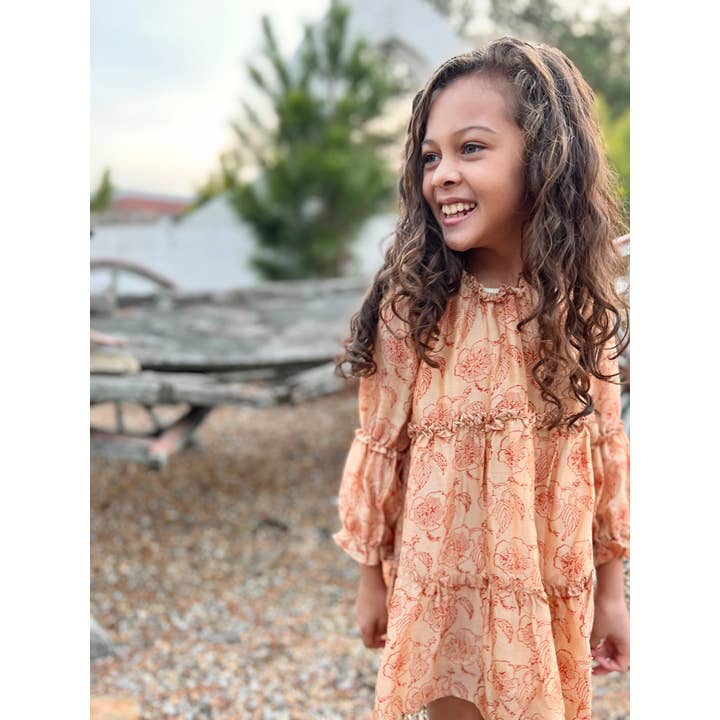 Tiered dress in peach flower print for wholesale by Poppet & Fox