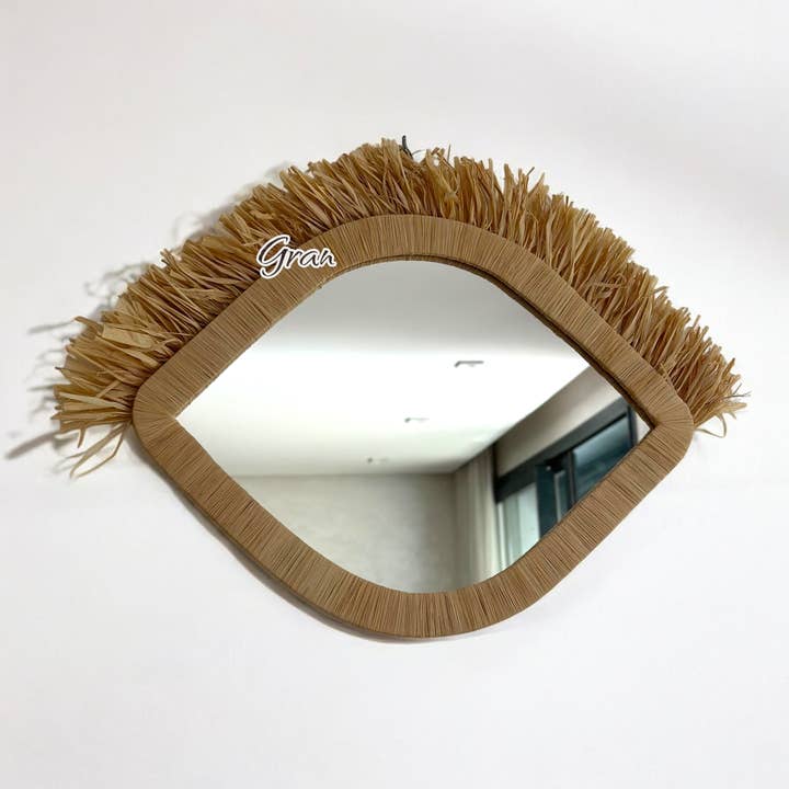 Handmade Eye-Shaped Raphia Wall Mirror for wholesale by Gran Wholesale