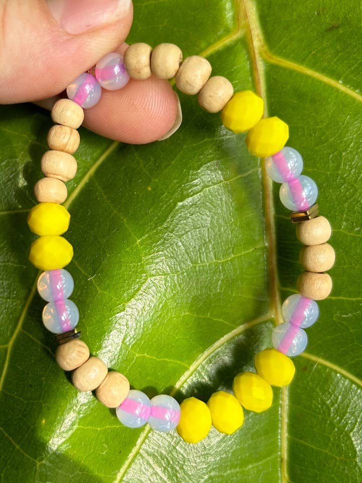 Magenta, Yellow And Wood Bead Bracelet With Gold Accents for wholesale by Good Vibes Beads Design
