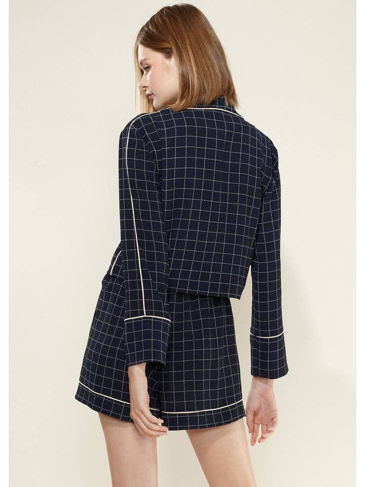 Nurode's Grid Print Blouse in Navy Plaid for wholesale on Faire