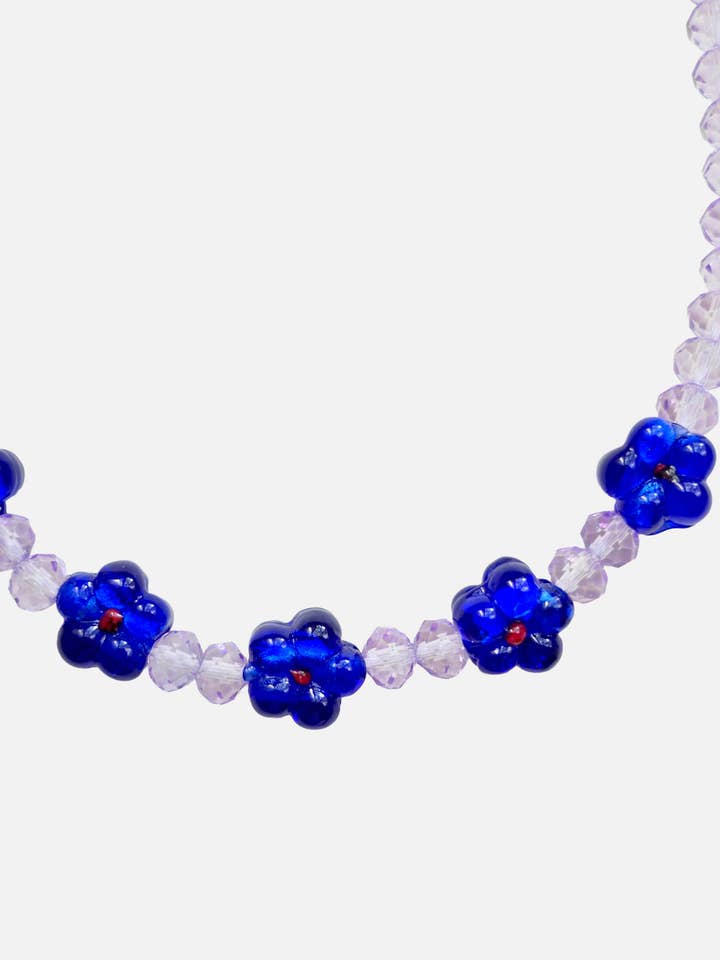 5 Donkerblauwe Bloemen & Lila Kralen voor wholesale door Le Club Olive