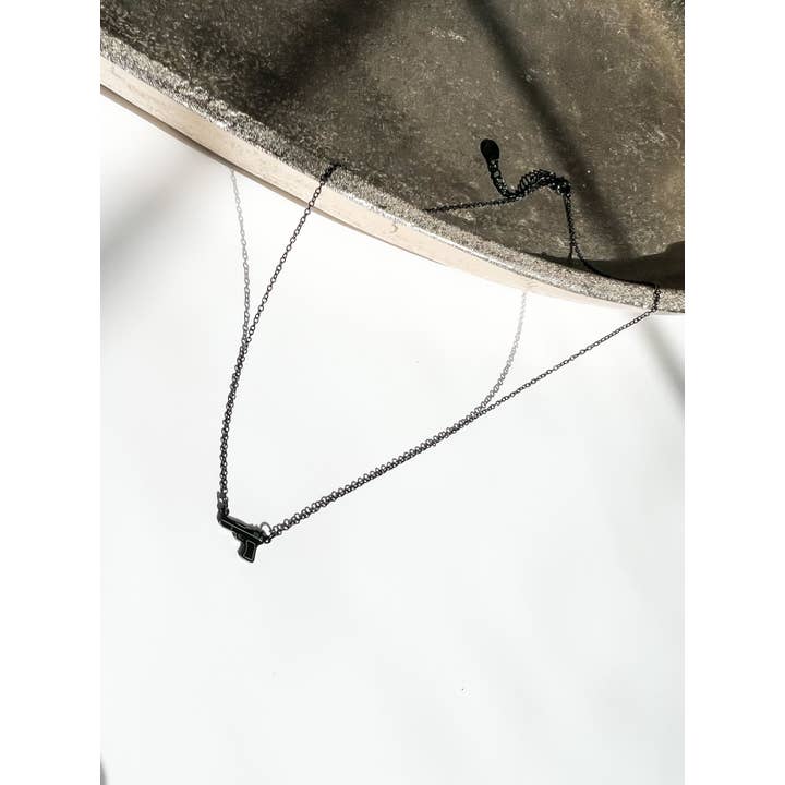 Armed In Style - Wholesale Pendant/Charm Necklace - Tiny Gun Necklace