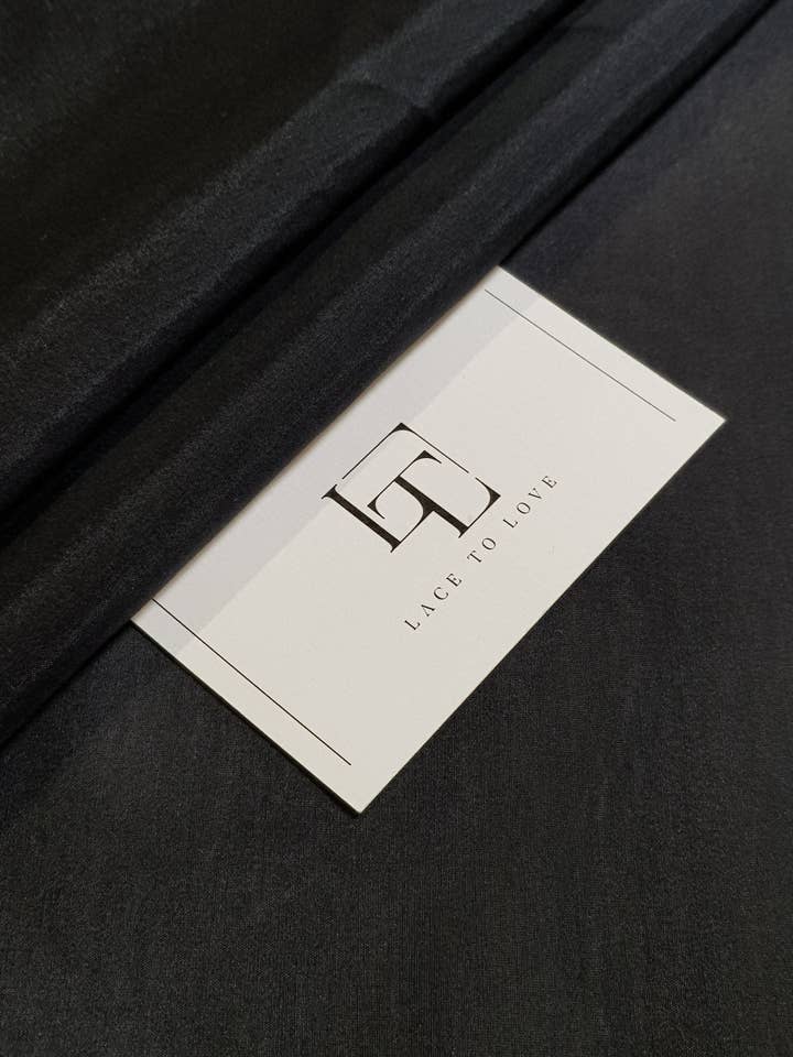 Svart sidenbomullstyg, säljs per meter för wholesale av Lace To Love