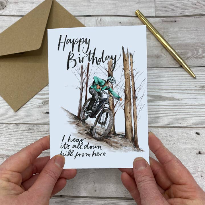 Biglietto di auguri Happy Birthday It's All Down Hill From Here per mountain bike per la vendita all'ingrosso da parte di Discover and Draw