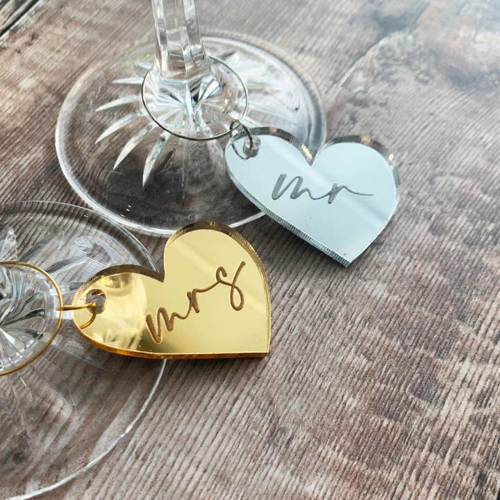 Anniversary Melting Heart Wine Glass Charm. for wholesale by Parkin & Lewis