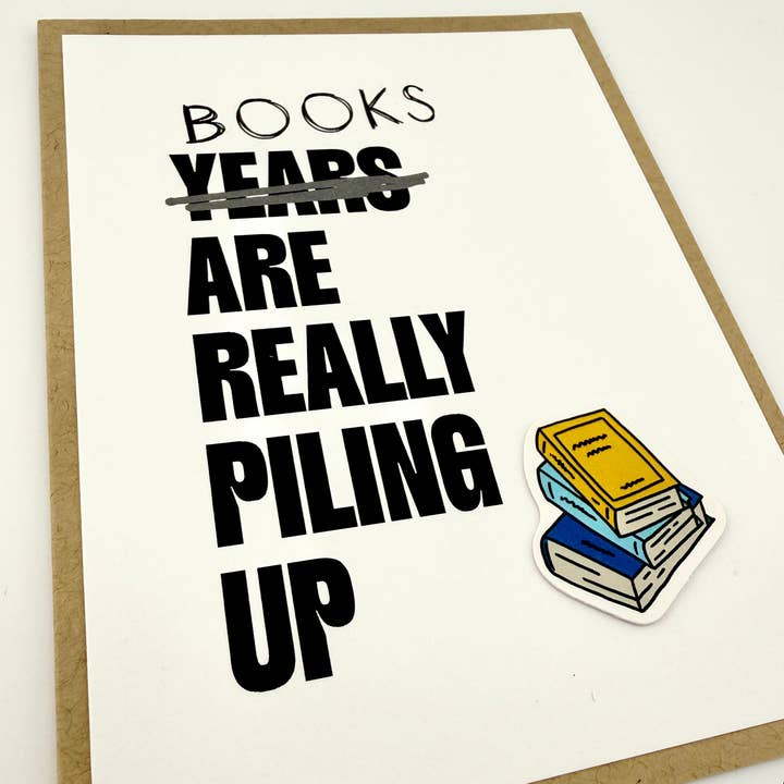 Books are Really Piling Up birthday card for wholesale by Muddy Mouth Cards