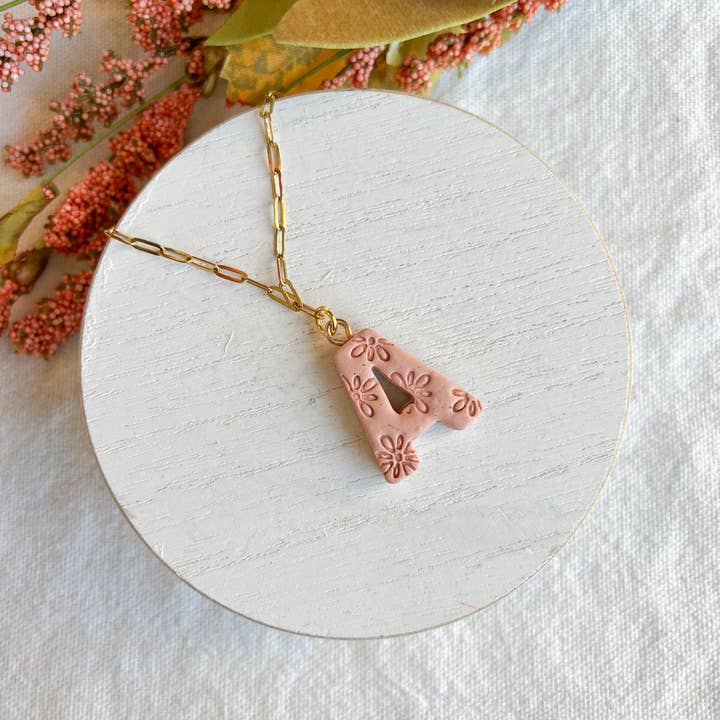 Floral Embossed Alphabet Polymer Clay Charms and other Purchase Wholesale alphabet charms. Free Returns & Net 60 Terms on Faire trending on Faire.