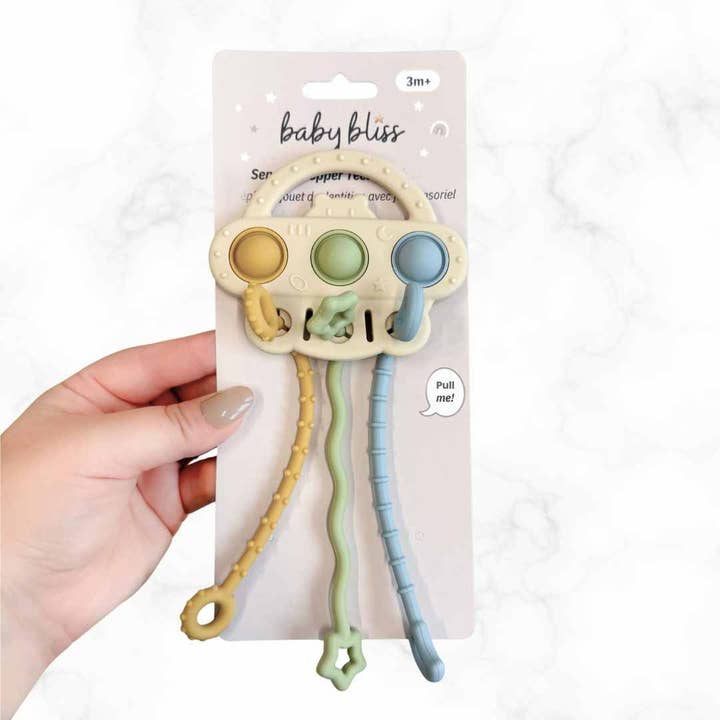 Jouet sensoriel à ficelle tirée pour la vente par Baby Bliss