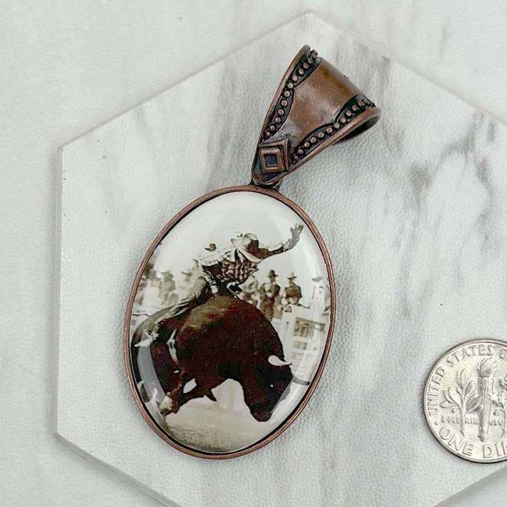 PD231210CP-75 Copper metal oval cowboy pendent for wholesale by Western Elite Jewelry