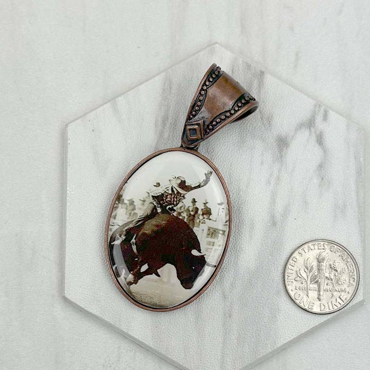 PD231210CP-75 Copper metal oval cowboy pendent for wholesale by Western Elite Jewelry